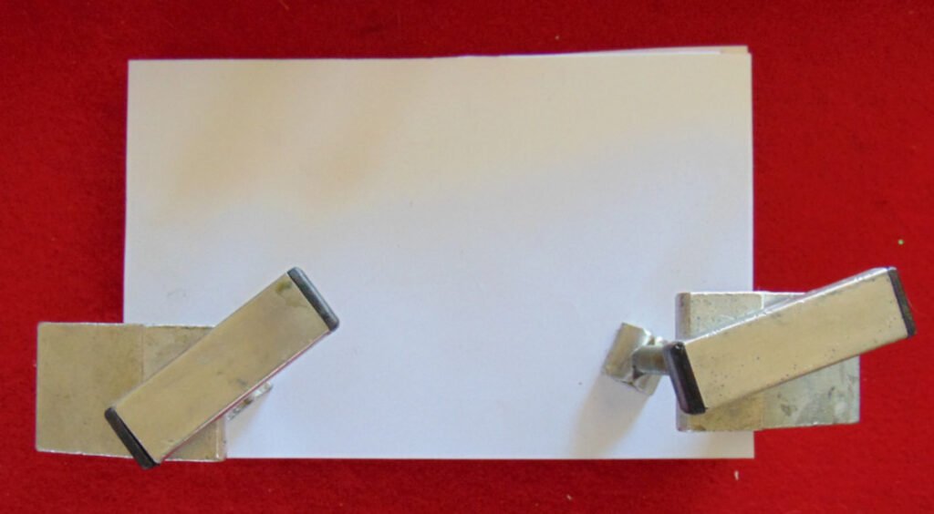 Manuscript held with clamps for binding